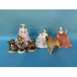 Three Hummel figures, two Coalport ladies, a Doulton figure and a Beswick dog