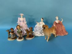 Three Hummel figures, two Coalport ladies, a Doulton figure and a Beswick dog