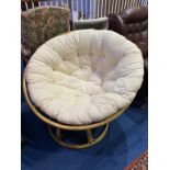 A large circular conservatory chair