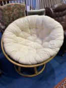 A large circular conservatory chair