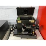 A Singer 222k sewing machine and case