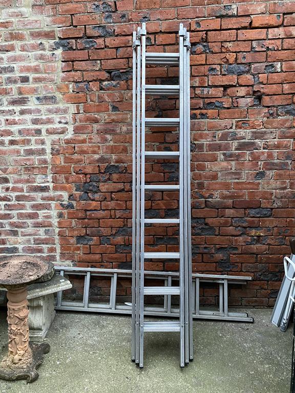 A set of aluminium three section property ladders