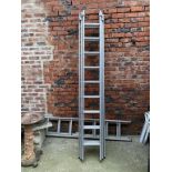 A set of aluminium three section property ladders