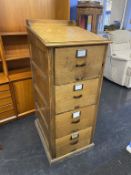 A 1930's oak four drawer Clarks filing cabinet