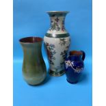 A Doulton stoneware water jug, a Penrith vase and a modern vase