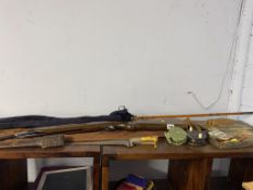 An air rifle, a split cane rod and reels and a dagger
