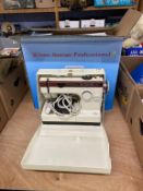 A Frister and Rossman CUB7 sewing machine and a boxed Frister and Rossman Professional Fashion