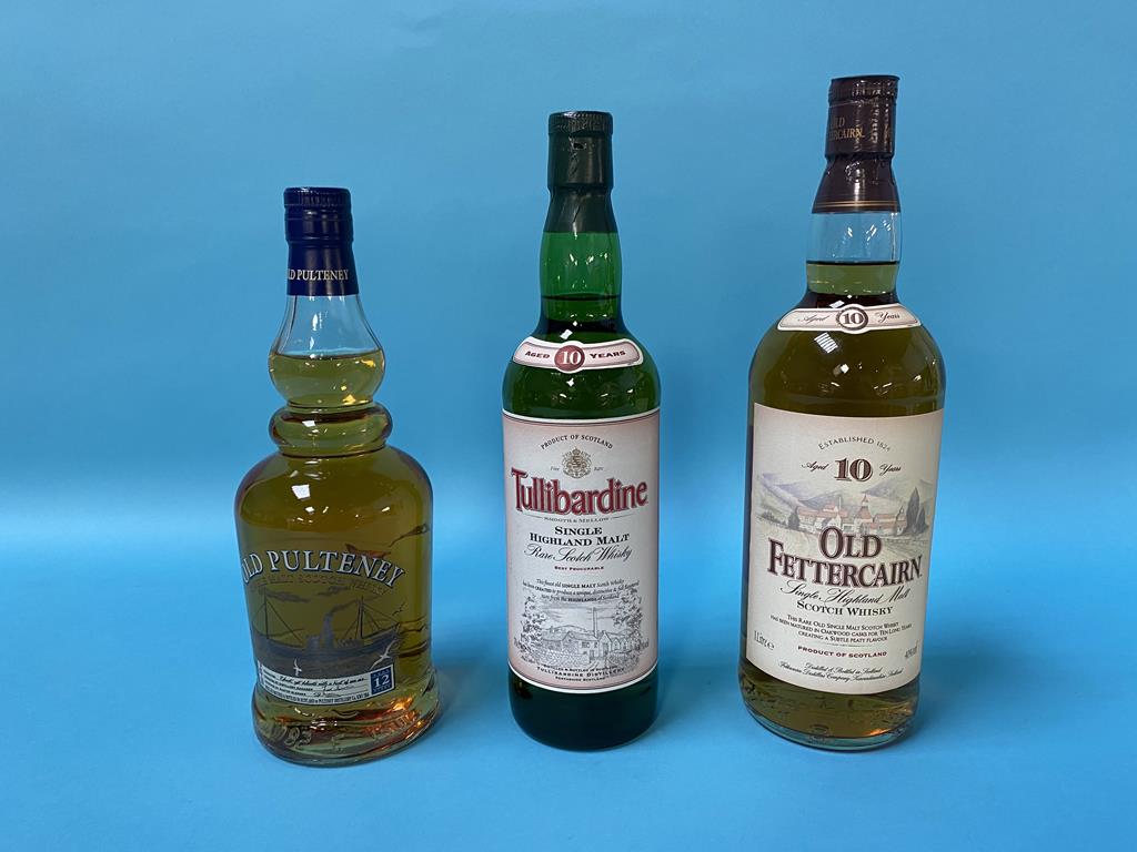 A bottle of Tullibardine 10 year old whisky, an Old Fettercairn 10 year old whisky and a bottle of