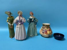 Three Goebel figures, 'Edwardian Grace', 'Gentle Thought', and 'Demure Elegance' and a Moorcroft
