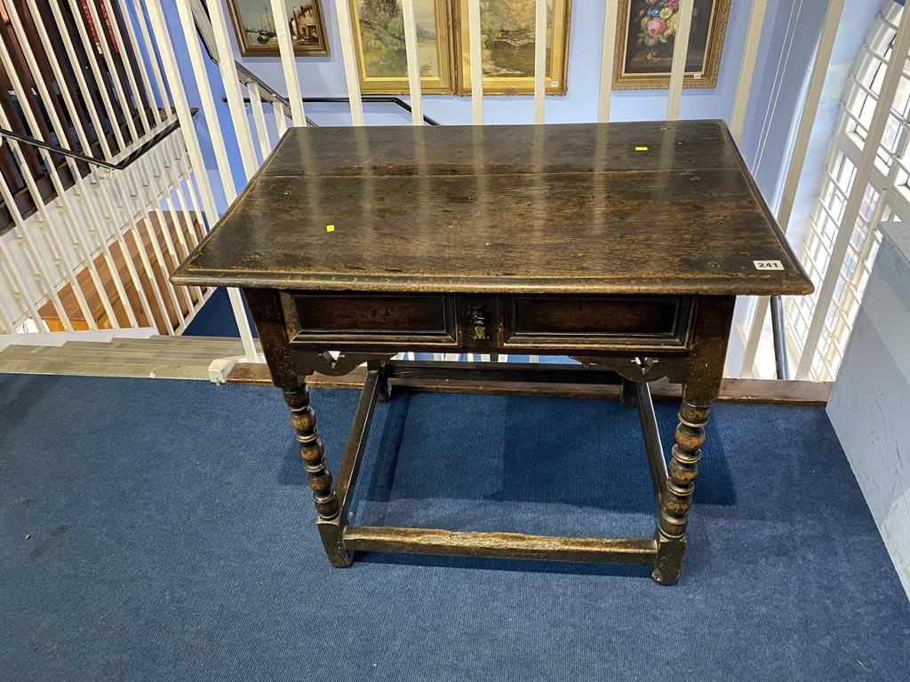 An Antique oak bobbin turned side table