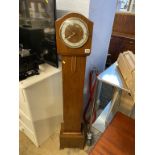 A walnut grandmother clock