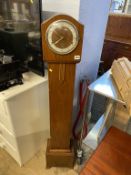 A walnut grandmother clock