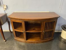 A modern hardwood bow front TV cabinet