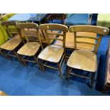 A set of four elm seat chapel chairs