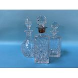 A silver rimmed decanter and two others (3)