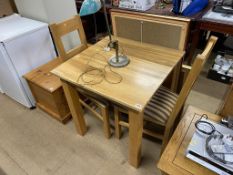 An oak table and two chairs