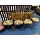 An Ercol gateleg table and four chairs