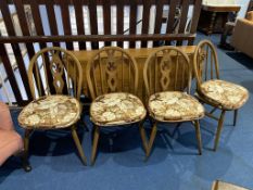 An Ercol gateleg table and four chairs