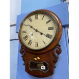 A mahogany circular drop dial wall clock