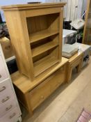 An oak bookcase and nest of tables