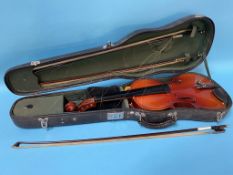 A violin and two bows in fitted case