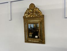 A brass framed mirror