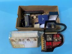 A box of costume jewellery and 1st day covers etc.