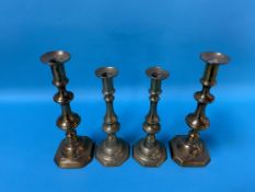 Two pairs of brass candle sticks
