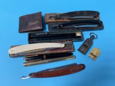 A collection of cut throat razors etc.
