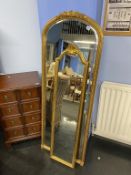 Two tall narrow gilt framed mirrors