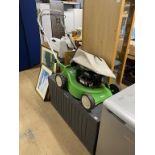 A garden tool box and a lawn mower