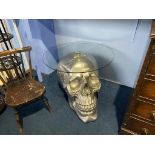 A silver skull occasional table