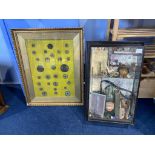 A framed collection of trinkets and framed coinage