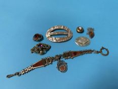 A bag of assorted jewellery, mother of pearl buckle, and Scottish agate style brooch etc.