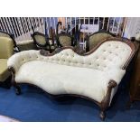 A reproduction mahogany chaise lounge