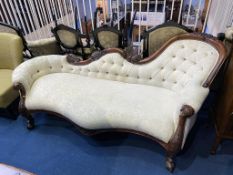 A reproduction mahogany chaise lounge