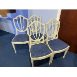 Four white painted chairs
