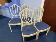 Four white painted chairs