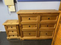 A pine chest of drawers and a pine bedside chest