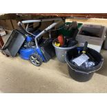 A lawn mower and two buckets of tools