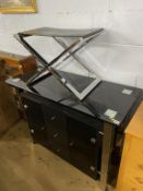 A chrome stool and modern sideboard
