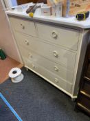 A cream chest of drawers
