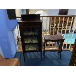 A china cabinet and stool