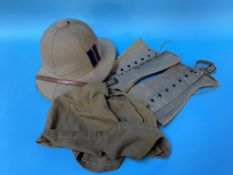 A J. Compton and Webb Limited of London pith helmet, bag and pair of garters