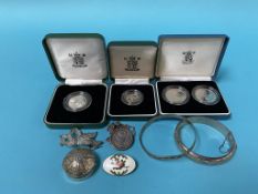 A 1992 silver proof ten pence coin, a 1989 £2 silver proof two coin set, a 1990 silver five pence