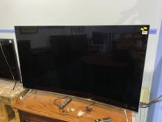 A Samsung Curve TV and remote