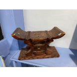 A carved Oriental stool