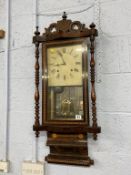 A rosewood wall clock