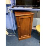 A mahogany single door cabinet