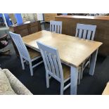 A matching As New extending table with four chairs